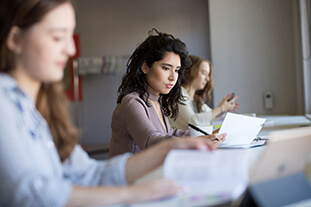 People reading over a document.